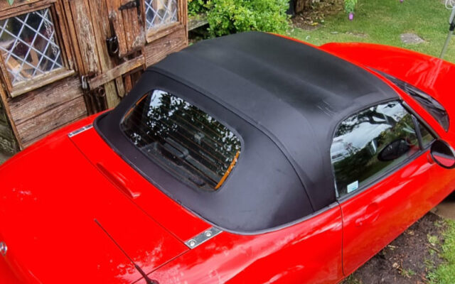 Clean red mazda convertible roof photo