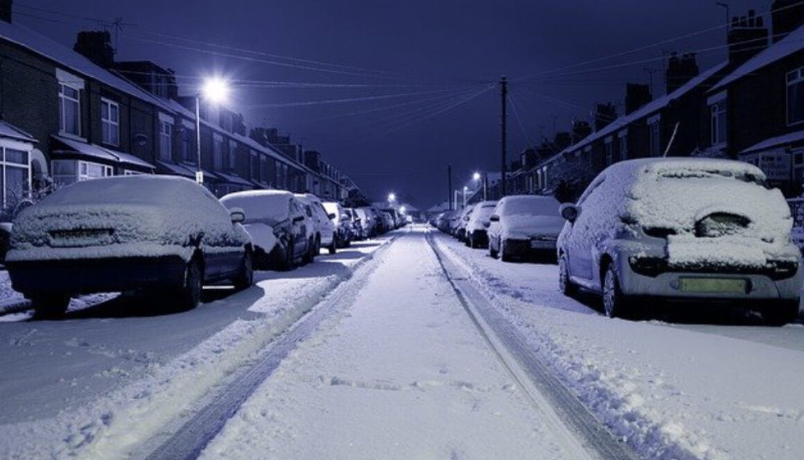 Snow covered road at night photo